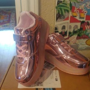 Beautiful brand new roller pink tennis shoes!!!